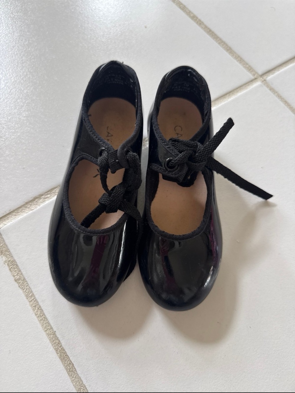 Capezio Tap shoes for toddlers in a toddler size 10 black patent leather